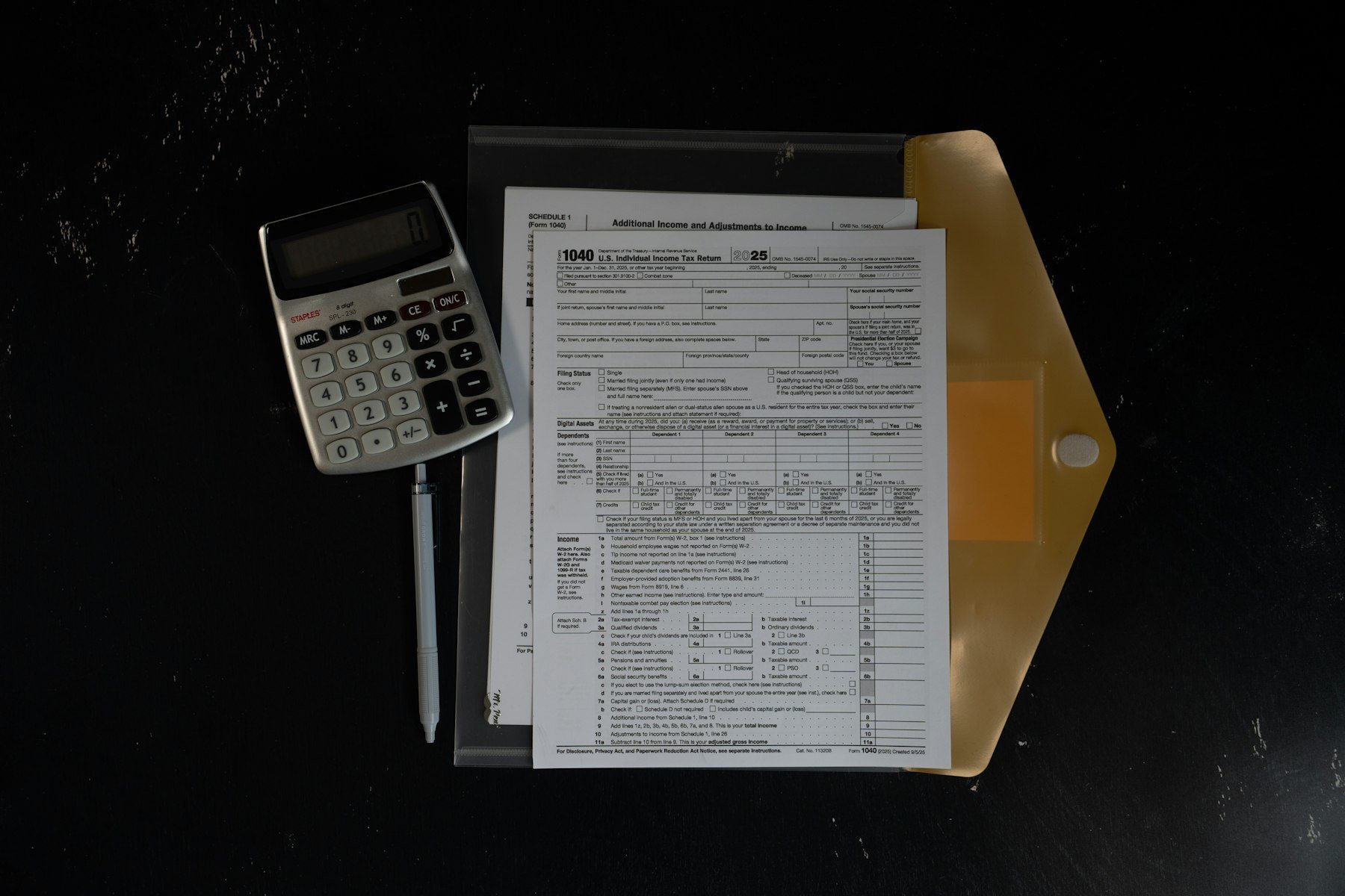 Calculator and financial paperwork prepared for planning.